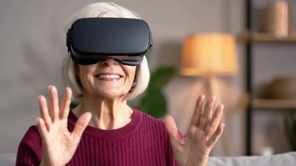 Smiling elderly woman using VR headset, senior exploring virtual reality, modern digital experience, immersive technology for older adults, innovative home entertainment - Powered by Adobe