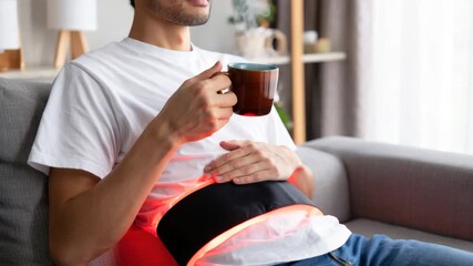 Red light therapy belt for pain relief, infrared abdominal recovery, muscle relaxation treatment, LED healing wrap, non-invasive wellness technology