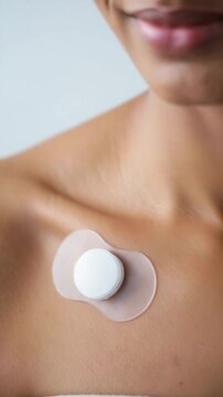 Wearable biosensor patch on chest, adhesive health monitoring device, skin-mounted medical technology, smart biometric tracker, modern biohacking tool