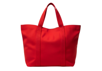A vibrant red tote bag, presented against a stark black background, is featured in a  shot.