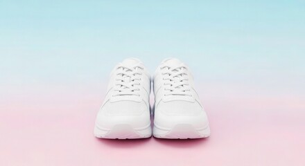 A pair of white sneakers with laces presented on a pastel gradient background in a studio setting