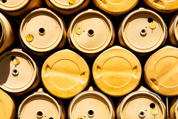 Stacked Yellow Plastic Barrels. industry, and repetition, suitable for themes related to logistics,...
