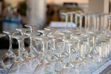 Martini glasses are washed and prepared upside down for the guests of the party at the venue