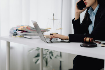 Attractive young lawyer in office Business woman and lawyers discussing contract papers with brass...