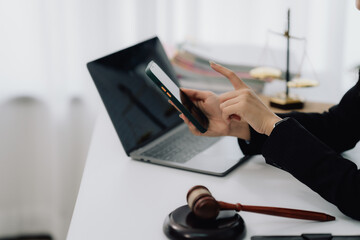 Attractive young lawyer in office Business woman and lawyers discussing contract papers with brass...
