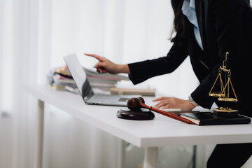 Attractive young lawyer in office Business woman and lawyers discussing contract papers with brass...