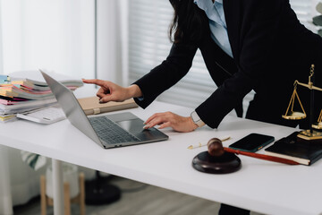 Attractive young lawyer in office Business woman and lawyers discussing contract papers with brass...