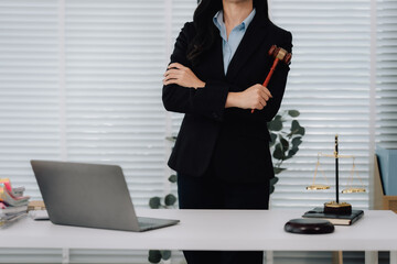 Attractive young lawyer in office Business woman and lawyers discussing contract papers with brass...