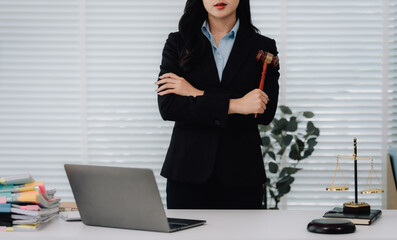 Attractive young lawyer in office Business woman and lawyers discussing contract papers with brass...