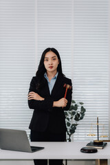 Attractive young lawyer in office Business woman and lawyers discussing contract papers with brass...
