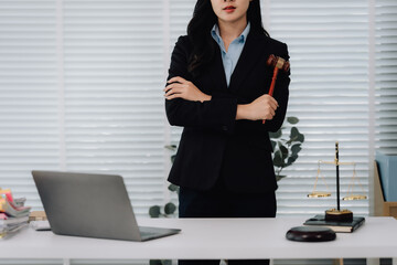 Attractive young lawyer in office Business woman and lawyers discussing contract papers with brass...