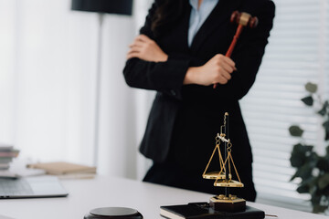 Attractive young lawyer in office Business woman and lawyers discussing contract papers with brass...