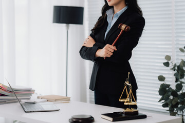 Attractive young lawyer in office Business woman and lawyers discussing contract papers with brass...