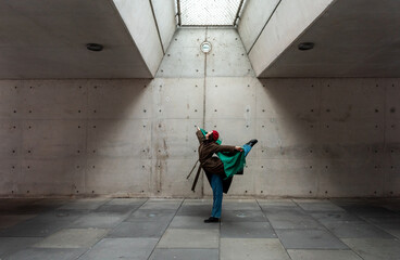 Ballerina in a casual outfit dancing in an underground station in Stuttgart city