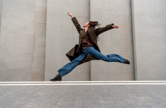 Ballerina in casual clothes dancing on the streets of Stuttgart city
