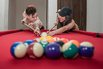 couple playing pool