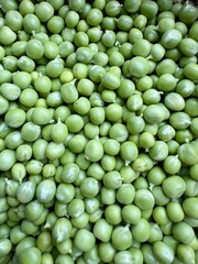 Healthy organic green peas background natural vegetarian protein food macro view