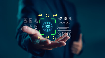 Businessman showing digital checklist with ISO certification icon, quality control documents and compliance symbols, concept of international standards, audit process and approval system.