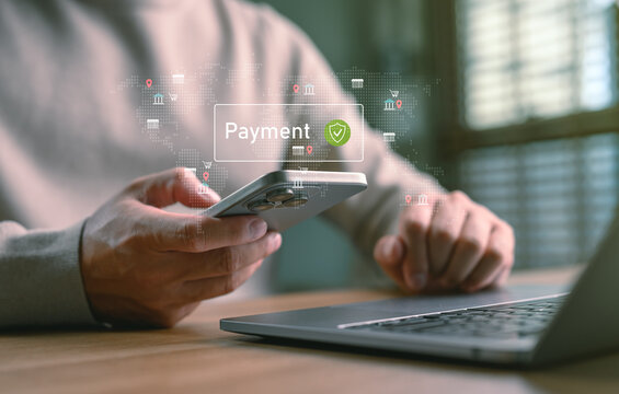 Man using smartphone for secure online payment with digital interface and world map overlay, representing fintech, global e-commerce, mobile banking, money transfer, and financial technology.