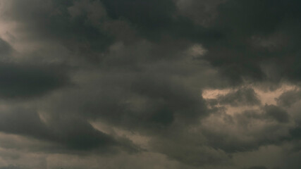 Dramatic dark storm thundercloud rain clouds on black sky background. Dark thunderstorm clouds...