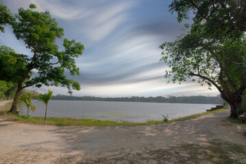 Beautiful landscape view of Neel Sagar lake under the cloudy sky.