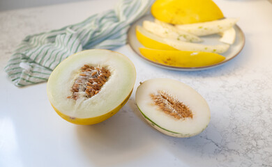 Canary and Snow Leopard Melon on Quartz Counter
