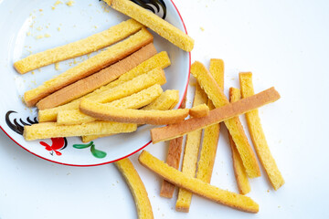 leftover crust edges from sliced white bread, collected as leftover trimmings. Often discarded, these firm pieces are now set aside for creative reuse as crispy snacks or toasted sides.
