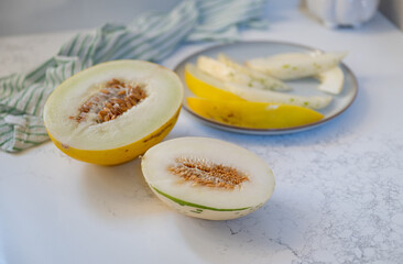 Canary and Snow Leopard Melon on Quartz Counter