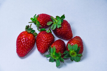 Fresh Ripe Strawberries with Green Leaves Isolated on White Background