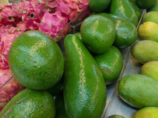 avocado with dragon fruit and mango at the market