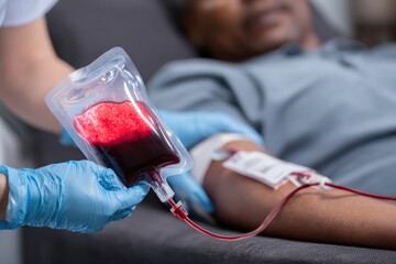 Nurse collecting blood donation from patient in hospital, emphasizing the vital role of healthcare in saving lives and supporting recovery