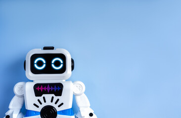 Cute boxy robot on blue background symbolizing AI assistant, chatbot, virtual support, smart...