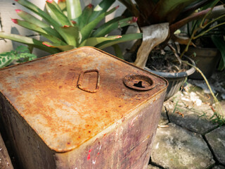 an old Rusty Metal Drum in Garden Setting