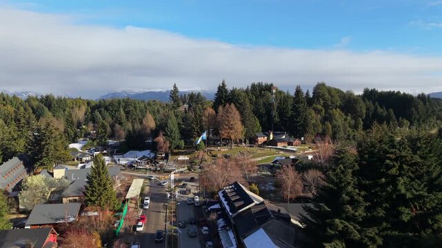 Aerial establishing fly Villa La Angostura, resort town on Nahuel Huapi Lake in Patagonia, Argentina, Daylight Panorama