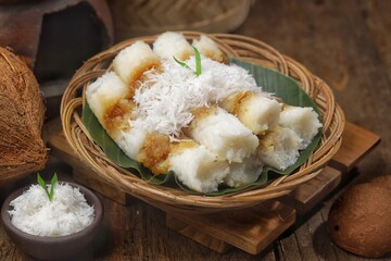 Putu bambu is another name for putu cake, a traditional Indonesian snack made from coarse rice flour with a brown sugar filling, wrapped in grated coconut, and steamed.