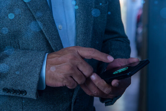 Man fingerprint identification on mobile phone to access personal financial data, mobile banking app, cyber security technology, data encryption. Biometric security network, privacy data protection.