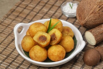 Misro or Klenyem is a snack made from grated cassava, the inside of which is filled with brown sugar and then fried