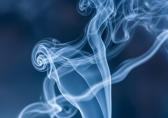 Ethereal Blue Smoke Patterns Creating Dreamy Visuals on a Gradient Dark Backdrop