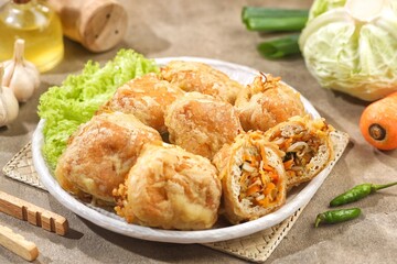 Tahu Isi. Stuffed tofu is known as fried food in the form of brown tofu filled with various fillings.