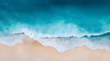 An overhead view of a pristine beach with crystal-clear water