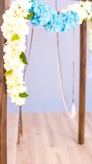 Floral archway with white and blue hydrangeas