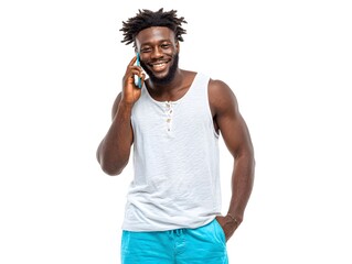 A handsome Black man in a white tank top smiles while talking on his smartphone against a white background.