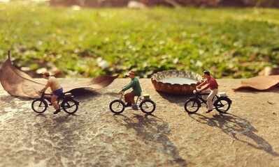 Mini toy of action figure at outdoor with blurred background. Miniature photography concept design....
