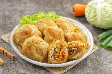 Tahu Isi. Stuffed tofu is known as fried food in the form of brown tofu filled with various fillings.