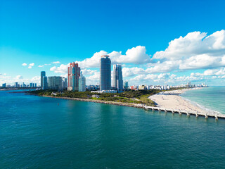 Naklejka premium Miami Beach aerial drone view with skyline. Miami from above. Drone view of Miamis famous landmarks. South Pointe beach with skyscrapers. Miami city panorama. Skyline of Miami Beach.