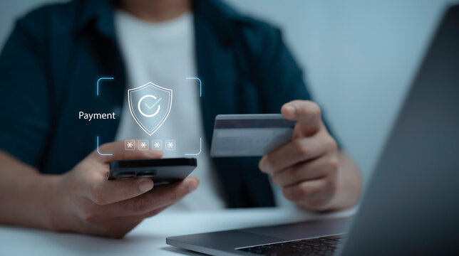 Businessman using smartphone and credit card with secure payment icon, representing online banking, mobile transaction, digital wallet, financial technology and secure ecommerce checkout