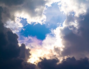 Dramatic sky with sunbeams piercing clouds