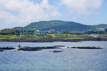 Cyclist on Basalt Spit