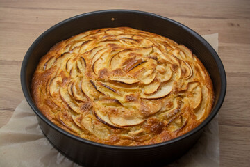 Homemade apple pie with cinnamon and vanilla, baked in a dish