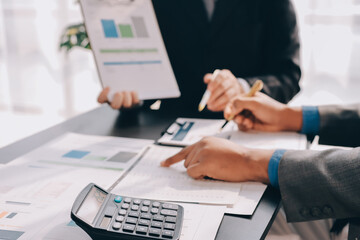 Accounting company provide finance and taxation planning for profitable cash flow, Auditor and accountant team working in office, analyze financial data and accounting record with calculator.Insight